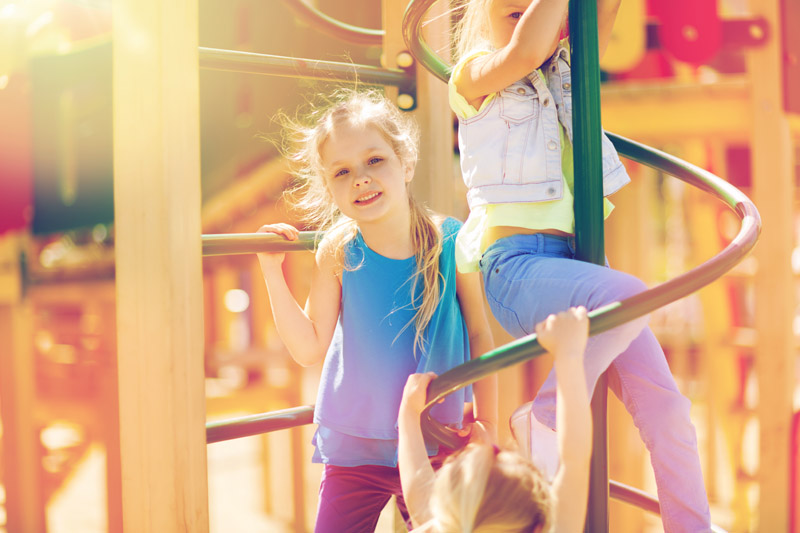 group-of-happy-kids-on-children-playground-P57YL4N.jpg