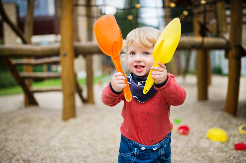 toddler-boy-playing-in-the-playground-summer-day-PB8C7FR.jpg